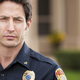 Image for article titled Police Officer Demonstrates Proper Technique For Subduing Grand Jury